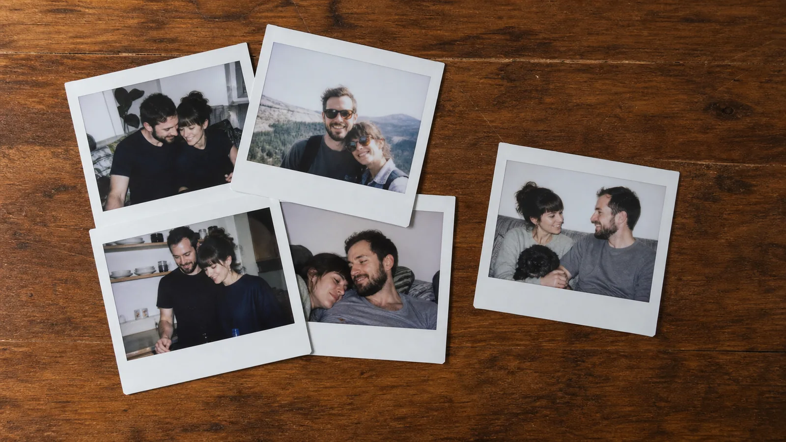 Five instant photographs of the same couple on a table, four overlapping in a pile and one pulled out on top
